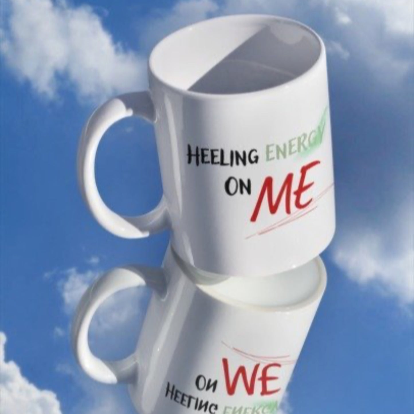 White mug with text against a blue sky background.