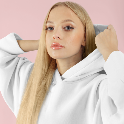 Woman wearing a white hoodie against a pink background