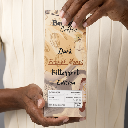 A person holding a bag of Buuble Coffee, Bitterroot Edition, with dark French roast labeled on it.