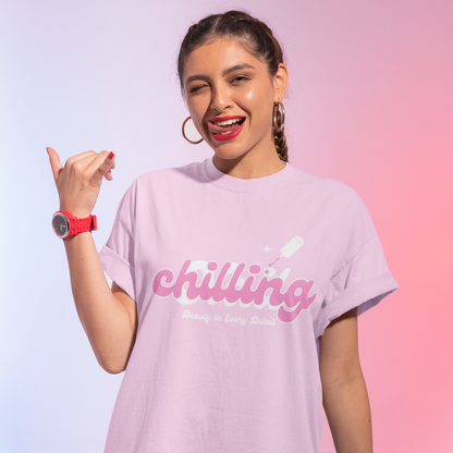 Woman wearing a light purple t-shirt with 'chilling' text on a gradient background