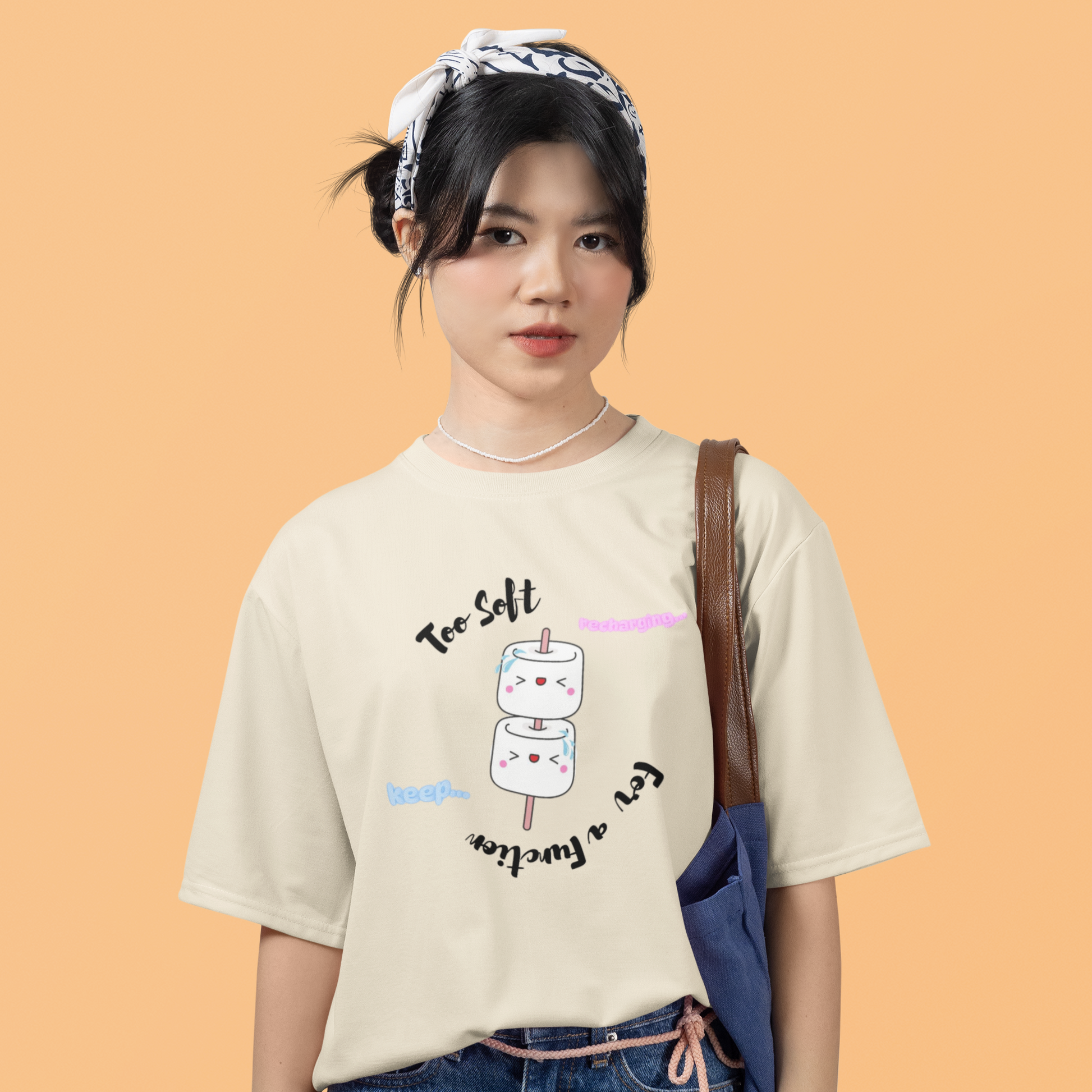 Person wearing a t-shirt with a graphic design on an orange background