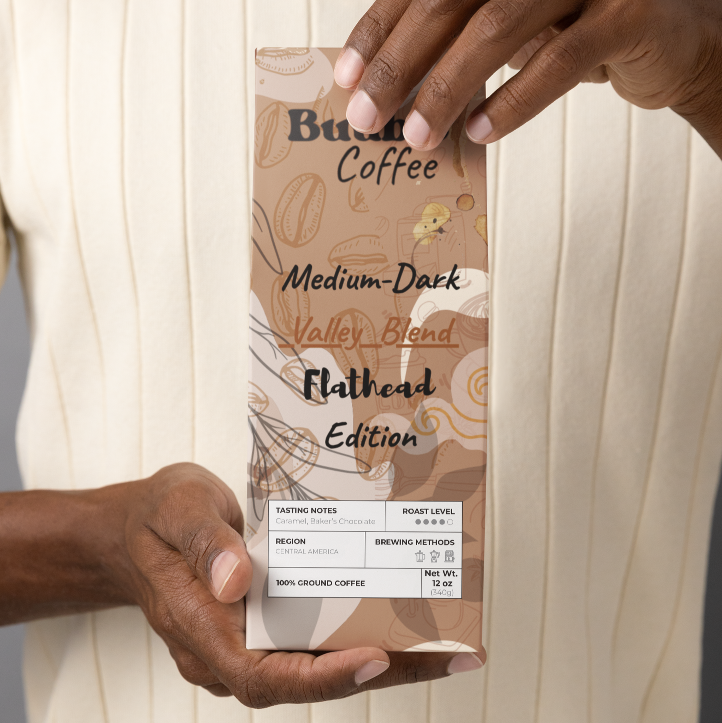 Person holding a coffee package labeled 'Buuble Coffee'.