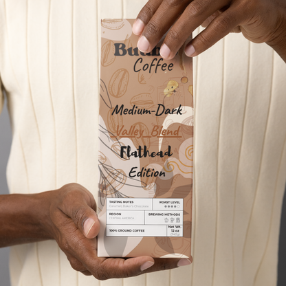 Person holding a coffee package labeled 'Buuble Coffee'.