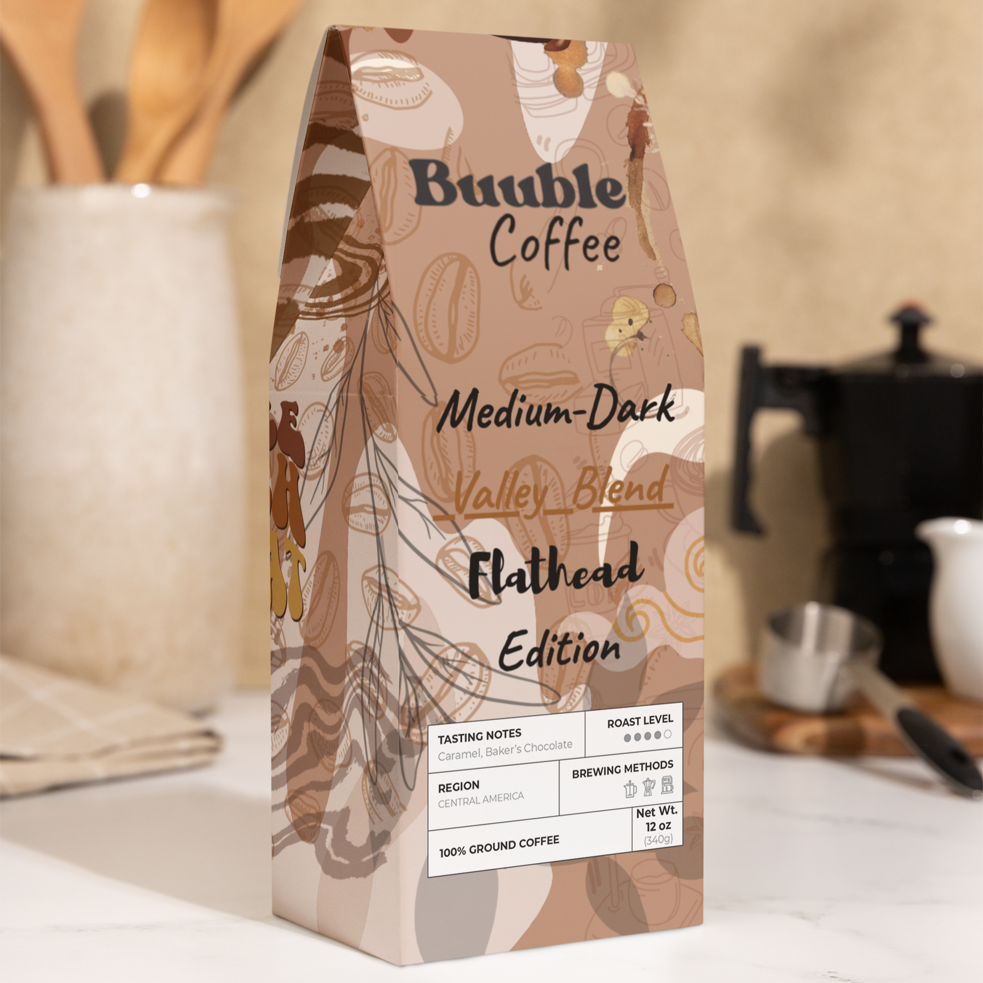 A package of Buuble Coffee, Flathead Valley Blend, Medium-Dark Roast, displayed on a kitchen counter.