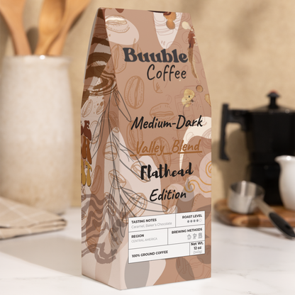 A package of Buuble Coffee, Flathead Valley Blend, Medium-Dark Roast, displayed on a kitchen counter.