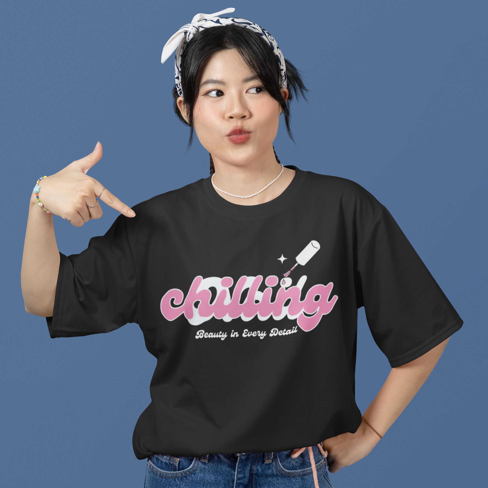 Person wearing a black t-shirt with 'chilling' text on a blue background