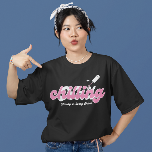 Person wearing a black t-shirt with 'chilling' text on a blue background