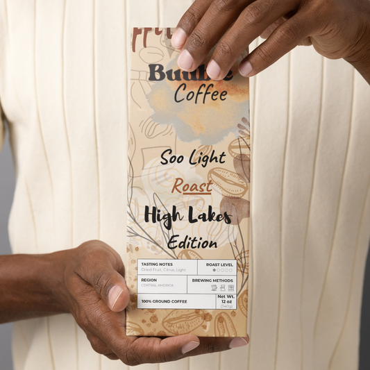 A person holding a bag of Buuble Coffee, High Lakes Edition, Soo Light Roast.