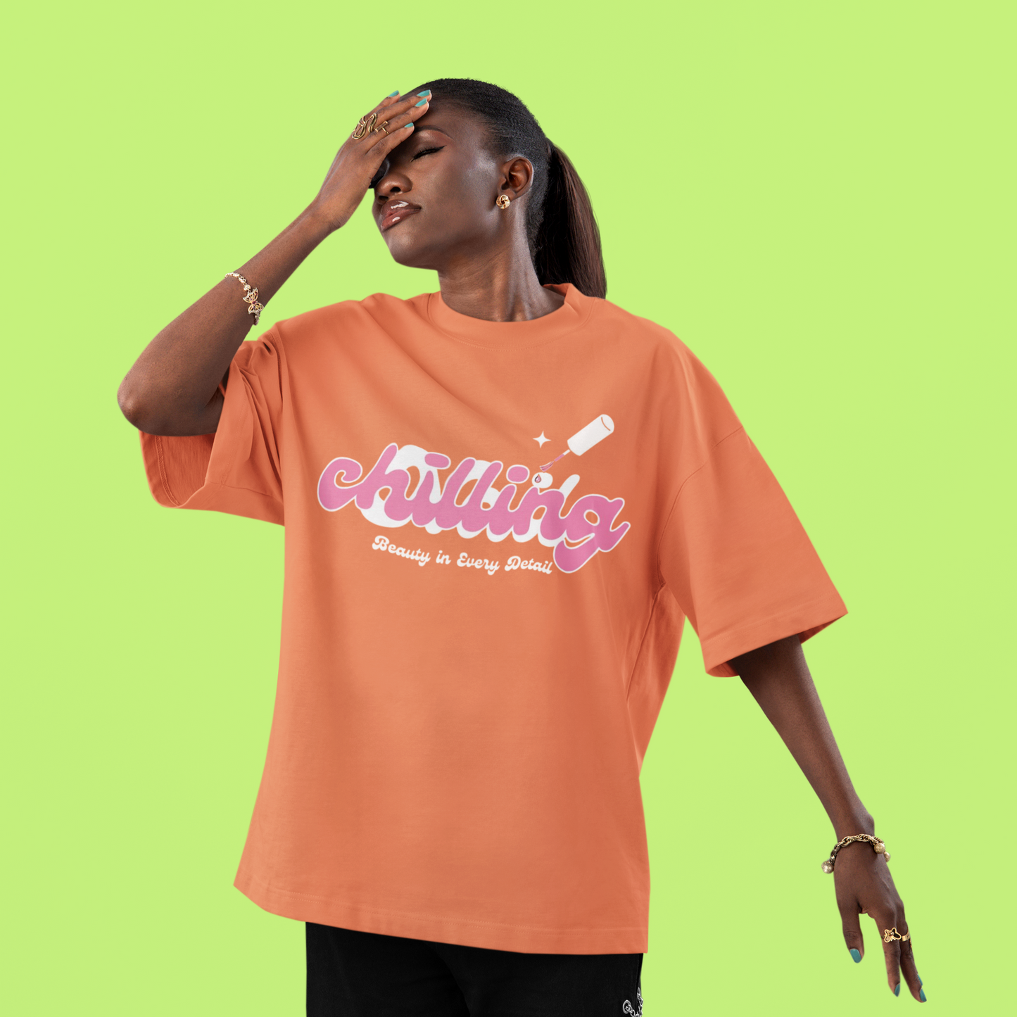 Person wearing an orange t-shirt with text on a green background